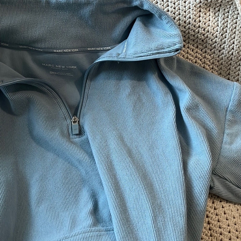 Woman’s blue pullover half zip